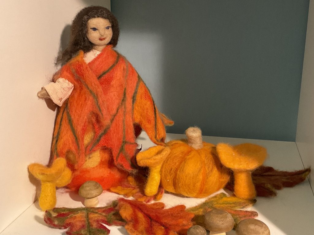 Nature tables can be made with seasonal-coloured items.